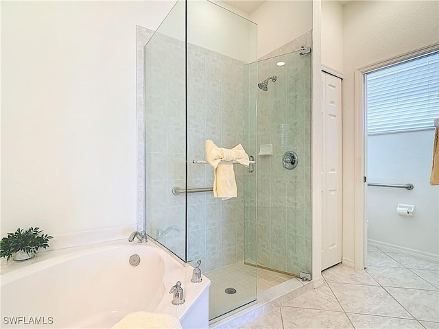 20716 Tisbury Ln, North Fort Myers, FL 33917 - full bathroom with tile patterned flooring, a bath, and a stall shower