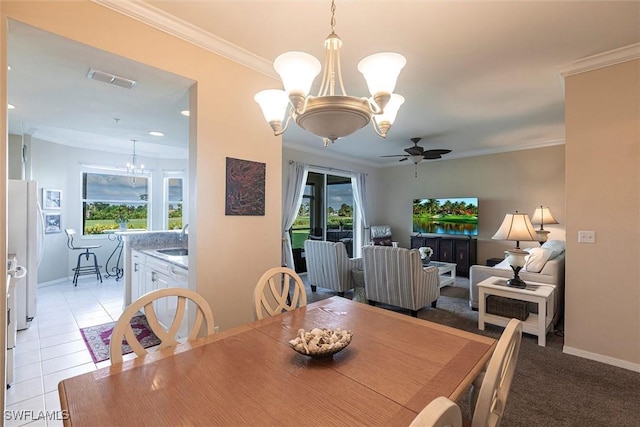 dining area with visible vents, ornamental molding, ceiling fan with notable chandelier, and a wealth of natural light