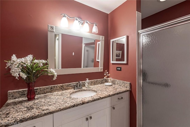 full bath featuring a shower stall and vanity