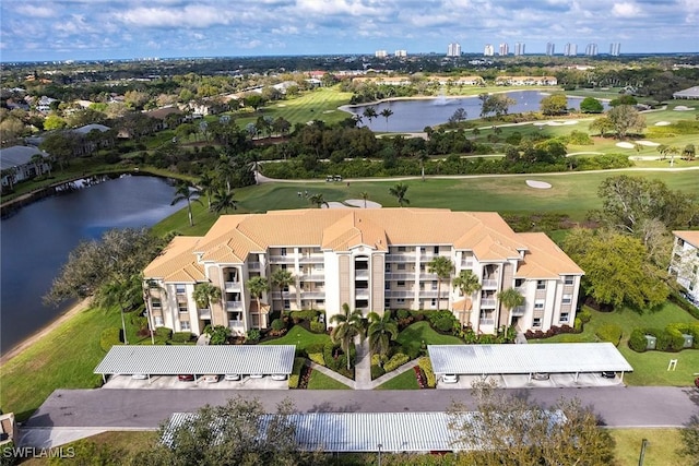 aerial view with a water view and golf course view