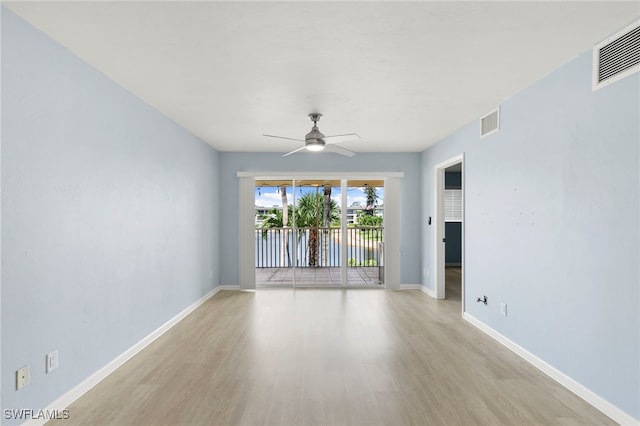 1004 Manatee Rd Unit H201, Naples, FL 34114 - spare room with light wood-style floors, ceiling fan, and a water view