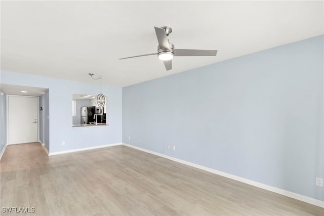 1004 Manatee Rd Unit H201, Naples, FL 34114 - empty room featuring ceiling fan and light wood-style floors