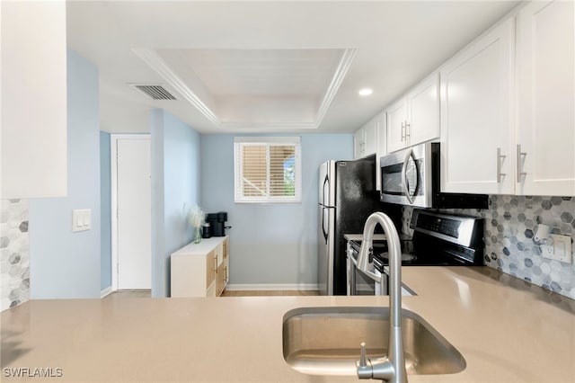 1004 Manatee Rd Unit H201, Naples, FL 34114 - kitchen featuring stainless steel appliances, white cabinets, tasteful backsplash, light countertops, and recessed lighting