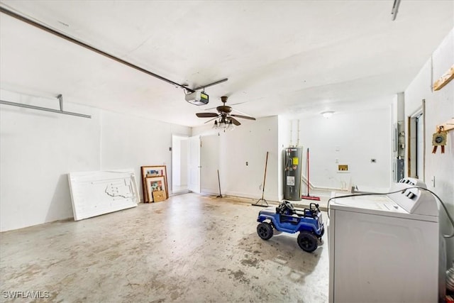 garage with a ceiling fan, a garage door opener, water heater, and washing machine and dryer
