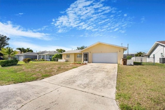 ranch-style home with a front yard, an attached garage, concrete driveway, and fence