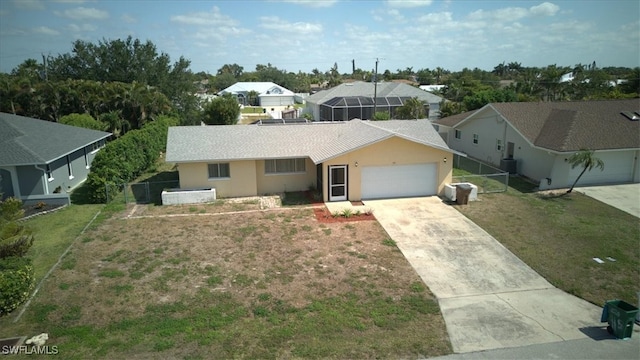 single story home featuring a residential view, an attached garage, driveway, stucco siding, and fence
