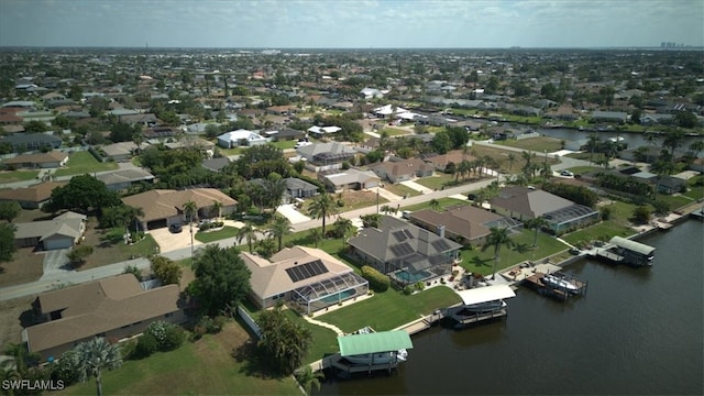 aerial view featuring a residential view and a water view