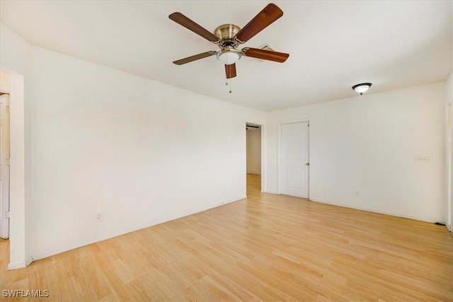 unfurnished room with ceiling fan and light wood-style flooring