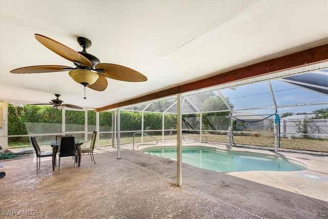 pool featuring a patio, fence, and a lanai
