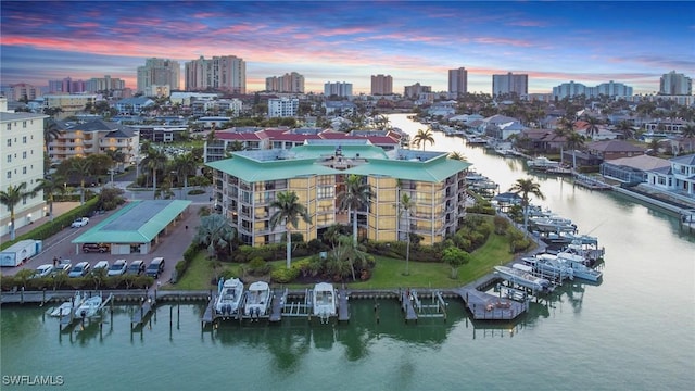 845 Collier Ct Unit 503, Marco Island, FL 34145 - aerial view at dusk of a view of skyline and a water view