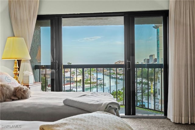 845 Collier Ct Unit 503, Marco Island, FL 34145 - carpeted bedroom with a water view and access to outside