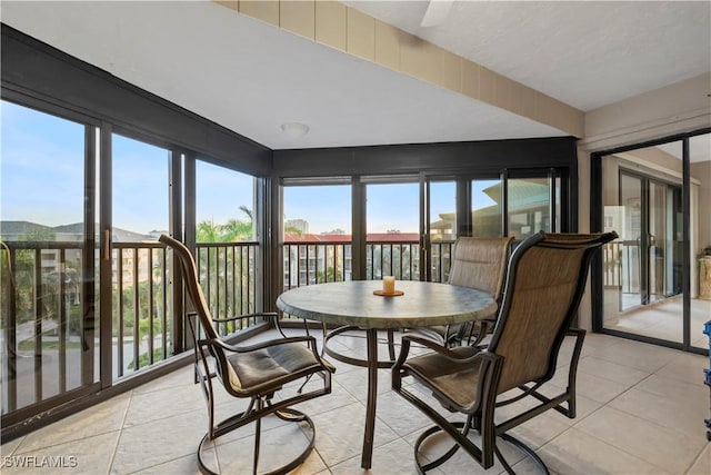 845 Collier Ct Unit 503, Marco Island, FL 34145 - sunroom featuring plenty of natural light and tile patterned floors