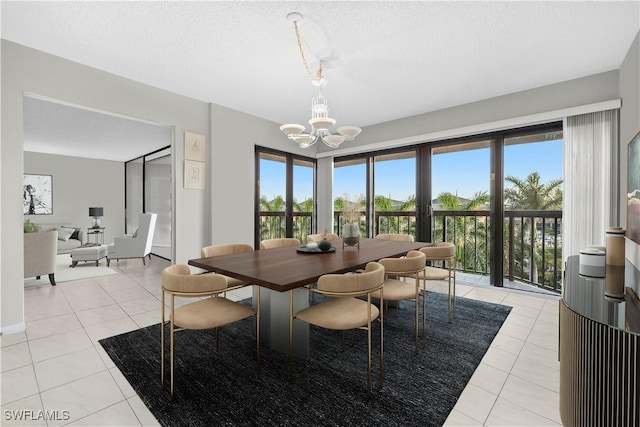 845 Collier Ct Unit 503, Marco Island, FL 34145 - dining space with light tile patterned floors, a chandelier, and a textured ceiling