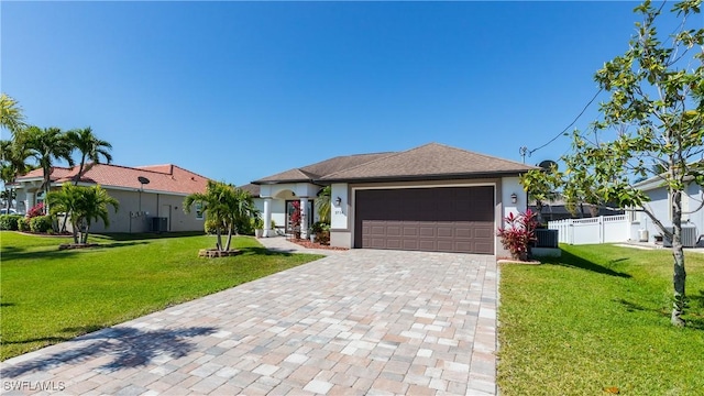 2714 SW 28th Ave, Cape Coral, FL 33914 - ranch-style house with stucco siding, a garage, a front lawn, and decorative driveway