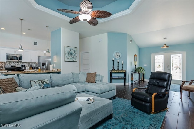 2714 SW 28th Ave, Cape Coral, FL 33914 - living area with french doors, a ceiling fan, dark wood-style flooring, and a raised ceiling
