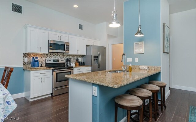 2714 SW 28th Ave, Cape Coral, FL 33914 - kitchen with backsplash, a sink, stainless steel appliances, and visible vents
