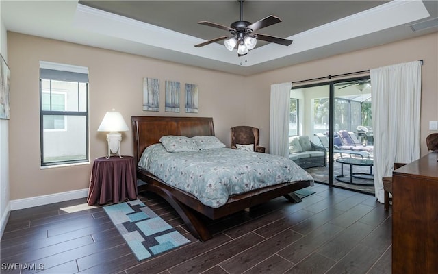 2714 SW 28th Ave, Cape Coral, FL 33914 - bedroom featuring a tray ceiling, access to outside, and multiple windows