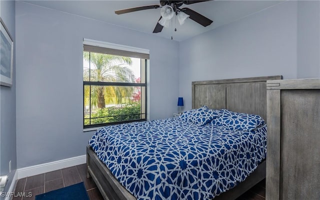 2714 SW 28th Ave, Cape Coral, FL 33914 - bedroom with baseboards and dark wood finished floors