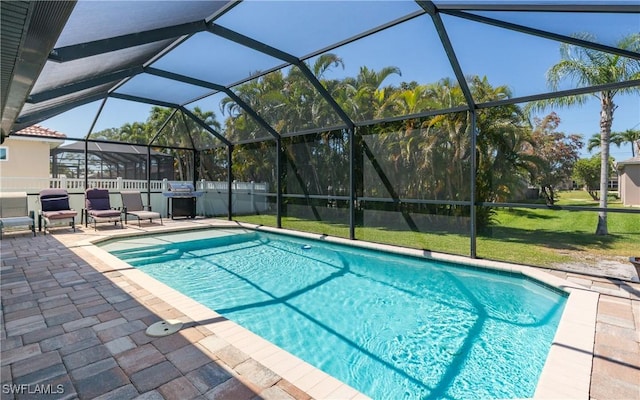 2714 SW 28th Ave, Cape Coral, FL 33914 - view of swimming pool with fence, a lanai, a fenced in pool, a lawn, and a patio area
