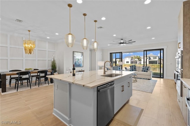 20333 Fair Oak Ln, Estero, FL 33928 - kitchen with visible vents, a sink, an island with sink, open floor plan, and stainless steel dishwasher