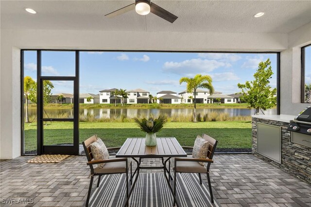 20333 Fair Oak Ln, Estero, FL 33928 - sunroom with a residential view and a water view