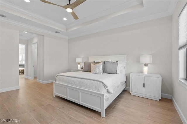 20333 Fair Oak Ln, Estero, FL 33928 - bedroom featuring light wood-style flooring, multiple windows, crown molding, and a raised ceiling