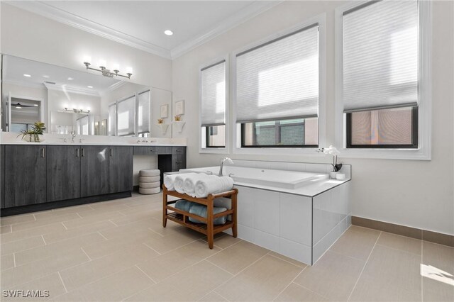 20333 Fair Oak Ln, Estero, FL 33928 - bathroom with crown molding, baseboards, tile patterned floors, vanity, and a garden tub