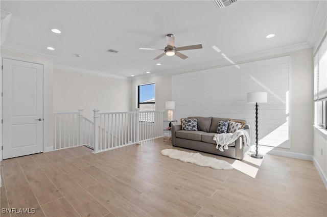 20333 Fair Oak Ln, Estero, FL 33928 - sitting room featuring a ceiling fan, crown molding, an upstairs landing, and light wood-style floors