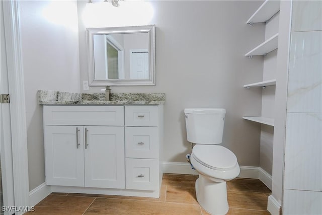 4636-4638 29th St SW, Lehigh Acres, FL 33973 - bathroom featuring toilet, vanity, and baseboards