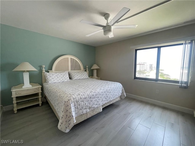 6672 Estero Blvd Unit A606, Fort Myers Beach, FL 33931 - bedroom with baseboards, wood finished floors, and a ceiling fan