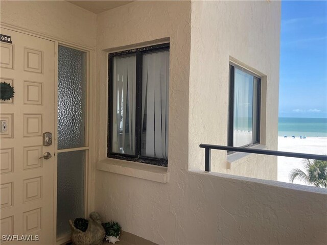 6672 Estero Blvd Unit A606, Fort Myers Beach, FL 33931 - doorway to property featuring a balcony and view of water and beach