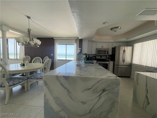 6672 Estero Blvd Unit A606, Fort Myers Beach, FL 33931 - kitchen featuring stainless steel appliances, a chandelier, healthy amount of natural light, and a sink