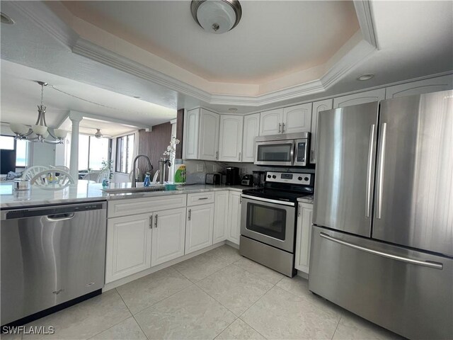 6672 Estero Blvd Unit A606, Fort Myers Beach, FL 33931 - kitchen with stainless steel appliances, a sink, light tile patterned floors, a chandelier, and white cabinetry