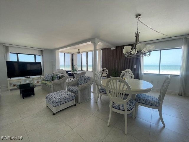 6672 Estero Blvd Unit A606, Fort Myers Beach, FL 33931 - dining room with a chandelier, healthy amount of natural light, light tile patterned floors, and a water view