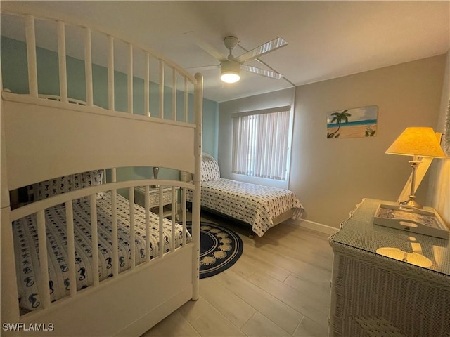 6672 Estero Blvd Unit A606, Fort Myers Beach, FL 33931 - bedroom with wood finished floors, baseboards, and ceiling fan