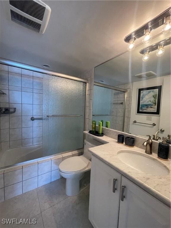 6672 Estero Blvd Unit A606, Fort Myers Beach, FL 33931 - bathroom featuring tile patterned floors, toilet, vanity, and tiled shower / bath combo