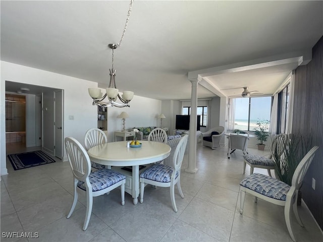 6672 Estero Blvd Unit A606, Fort Myers Beach, FL 33931 - dining area with a chandelier, a ceiling fan, ornate columns, and light tile patterned floors