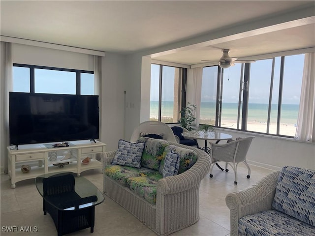 6672 Estero Blvd Unit A606, Fort Myers Beach, FL 33931 - tiled living room featuring ceiling fan and a water view
