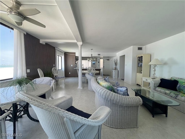 6672 Estero Blvd Unit A606, Fort Myers Beach, FL 33931 - living room featuring ceiling fan, ornate columns, and light tile patterned floors