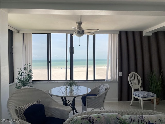6672 Estero Blvd Unit A606, Fort Myers Beach, FL 33931 - dining area featuring a ceiling fan, view of water and beach, and baseboards