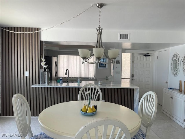 6672 Estero Blvd Unit A606, Fort Myers Beach, FL 33931 - dining space featuring a chandelier