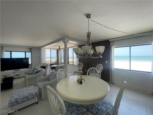 6672 Estero Blvd Unit A606, Fort Myers Beach, FL 33931 - dining room featuring a chandelier, light tile patterned floors, a water view, and plenty of natural light