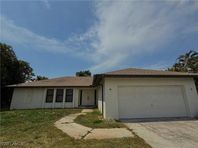 13470 Mcgregor Blvd, Fort Myers, FL 33919 - ranch-style house with concrete driveway, an attached garage, and stucco siding