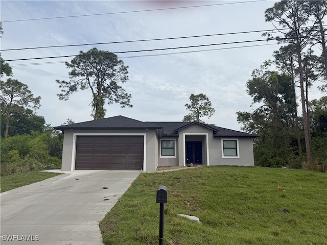 view of front of house with driveway, a front yard, roof with shingles, stucco siding, and an attached garage