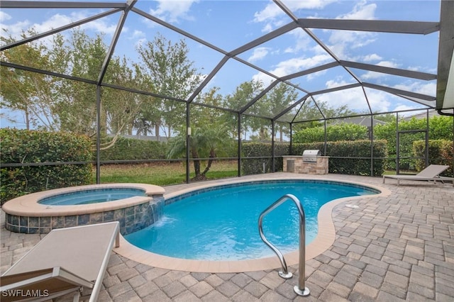 16286 Bonita Landing Cir, Bonita Springs, FL 34135 - view of swimming pool featuring glass enclosure, a pool with connected hot tub, exterior kitchen, and a patio