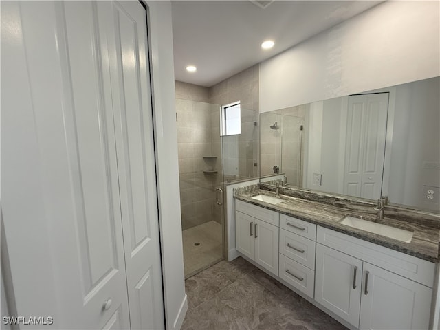 2803 17th St W, Lehigh Acres, FL 33971 - bathroom featuring double vanity, a sink, a stall shower, and recessed lighting