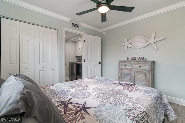 bedroom featuring a closet, ornamental molding, visible vents, wood finished floors, and baseboards