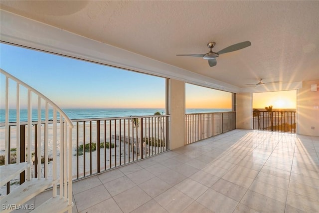 3127 W Gulf Dr Unit 106, Sanibel, FL 33957 - sunroom featuring a water view and a beach view