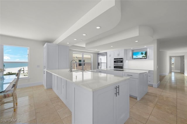 3127 W Gulf Dr Unit 106, Sanibel, FL 33957 - kitchen with a wealth of natural light, a sink, a peninsula, and appliances with stainless steel finishes