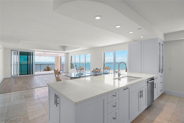 3127 W Gulf Dr Unit 106, Sanibel, FL 33957 - kitchen with a peninsula, dishwasher, light stone countertops, recessed lighting, and a sink
